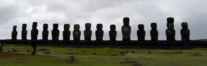 Photograph showing all fifteen restored moai on the platform at Ahu Tongariki.