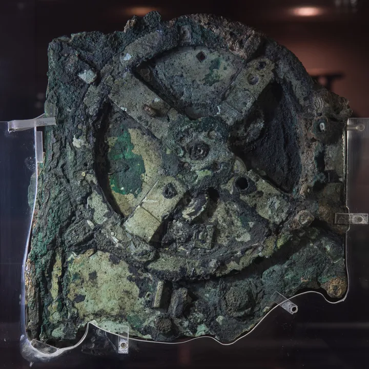 Photograph of the front of Antikythera Fragment A, showing corroded bronze and surviving gearwork.